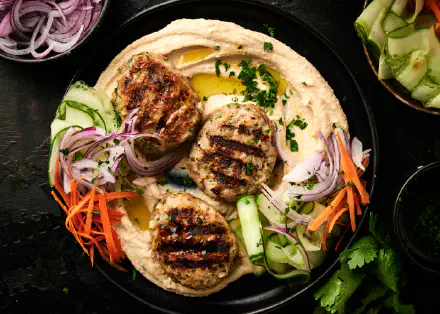 Elevate your mealtime with these delicious and nutritious Chicken Koftas served with creamy hummus and fresh veggies.
